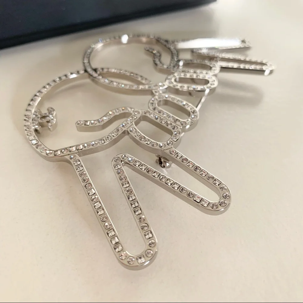Chanel large peace hands pin